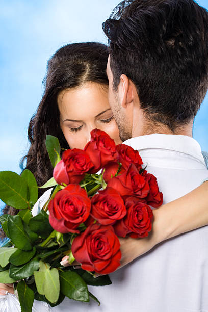 istock Couple with red roses 174826722
