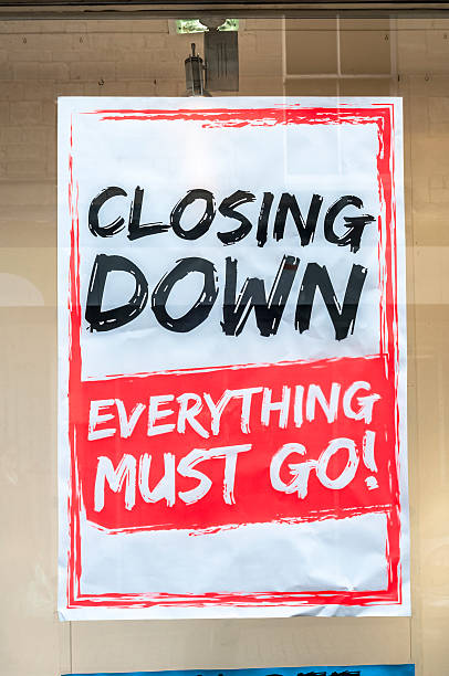 Closing Down Sign In A Shop Window Closing Down Sign In A Shop Window closing down sale stock pictures, royalty-free photos & images