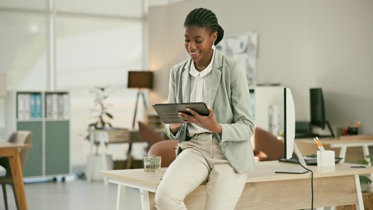 Business, employee and black woman with a tablet, typing and smile with connection, social media and contact. African person, happy consultant or entrepreneur with technology, internet or digital app