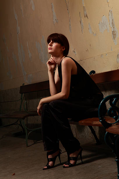 istock Woman on bench at the station 174827114