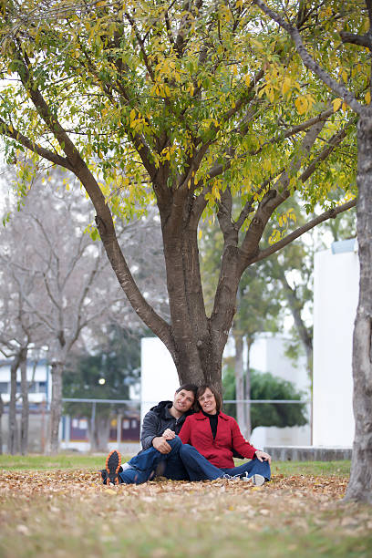 istock couple having fun in the park 174827298
