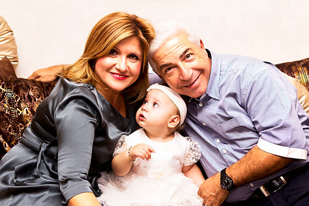 istock Grandparents with their granddaughter 174827741