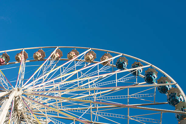 istock Ferris wheel against blue sky 174827972