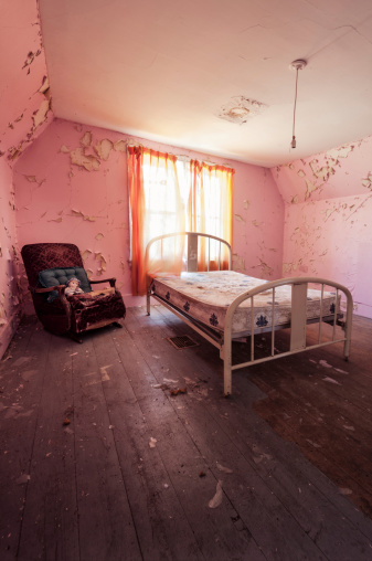 An empty girls bedroom in an abandoned house.
