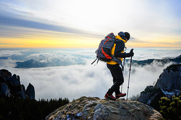 istock Hiker on a mountain with foamy sea in background 174828730