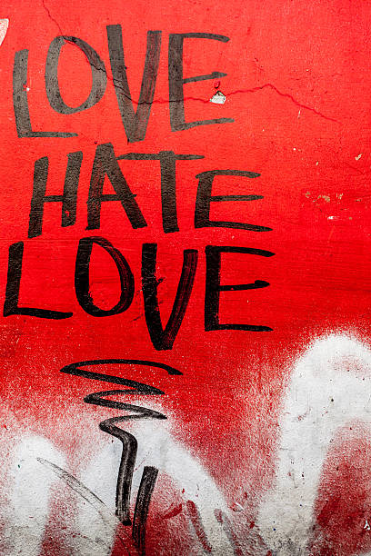 el amor y el odio escribir sobre rojo grunge wall - uneven ancient old spotted fotografías e imágenes de stock