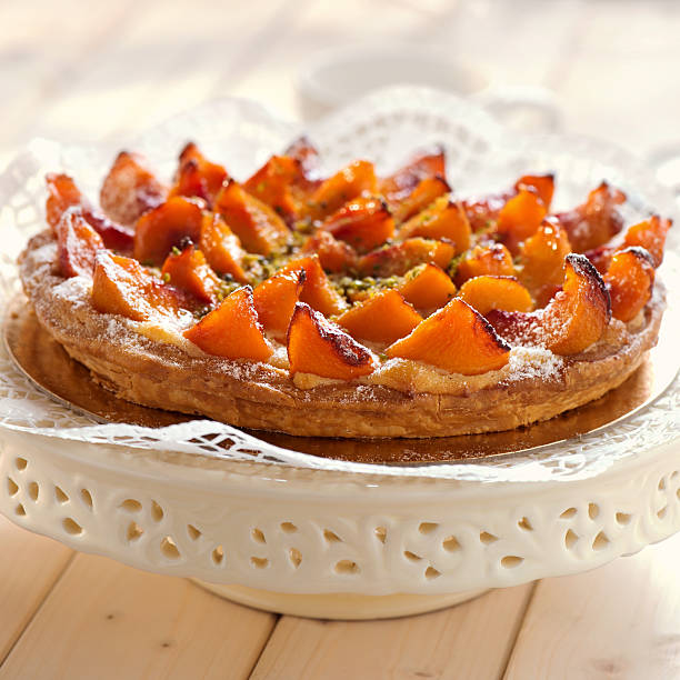 Fresh peach tart with chopped pistachio
