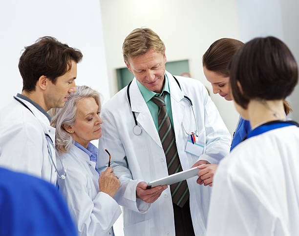 istock Hospital staff talking about patient care 174829856