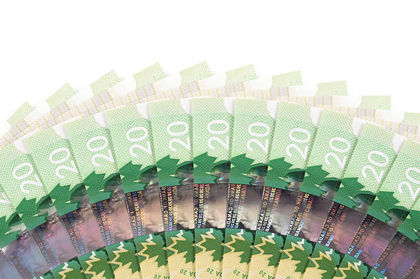 Fanned Out Canadian Twenty Dollar (20) Bills Fanned out Canadian twenty dollar ($20) bills on white background. canadian currency photos stock pictures, royalty-free photos & images