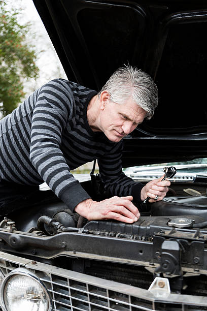 istock Senior Man Works on Car 174830096