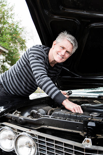 istock Senior Man Works on Car 174830101