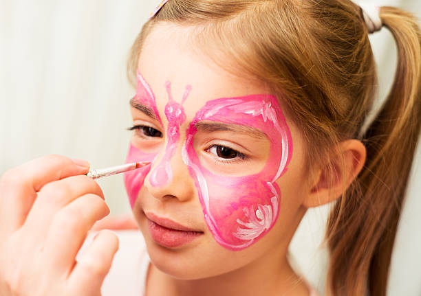 istock Girl enjoying face painting 174830346