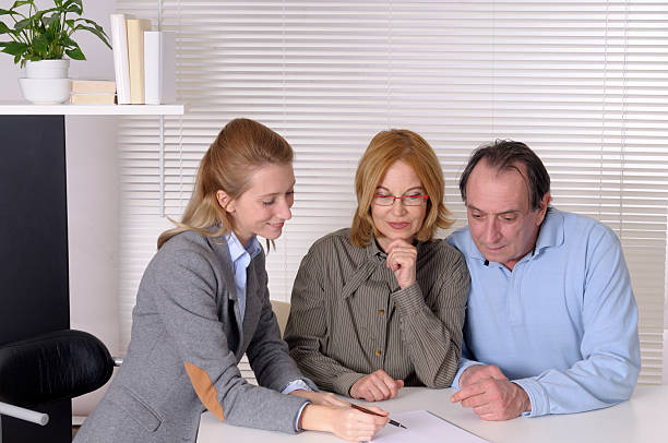 istock Financial Advisor and Mature Couple 174830365