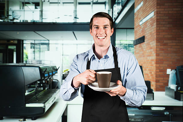 istock Smiling barista in a coffee bar 174830627