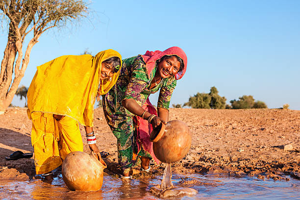 istock Indian women collecting water, Rajasthan 174831044