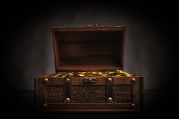 istock treasure chest full of gold 174831430