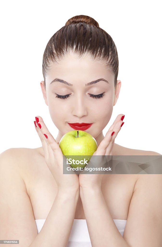 Hermosa mujer con manzana sobre fondo blanco - Foto de stock de 20-24 años libre de derechos