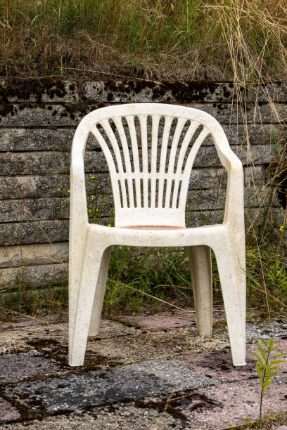 single white garden chair in summer stock photo