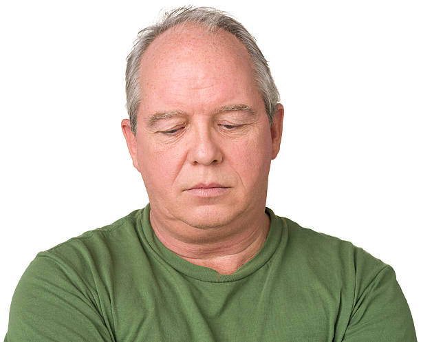 istock Somber Mature Man Looks Down 174831593
