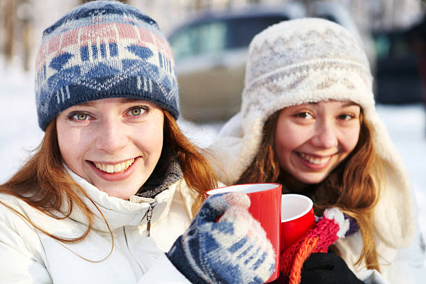 istock Outdoors on a winter day. Girls drink tea. 174831710