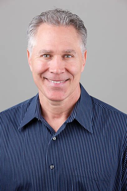 istock Smiling middle age man with dark blue shirt 174831802