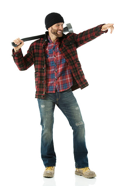 istock Smiling lumberman carrying an axe and pointing 174832662
