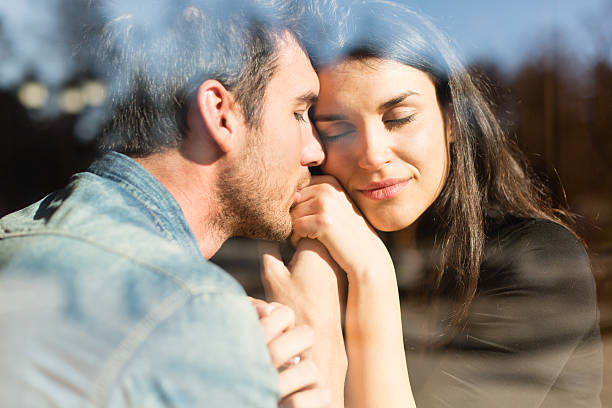 istock Romantic couple behind glass window 174832832