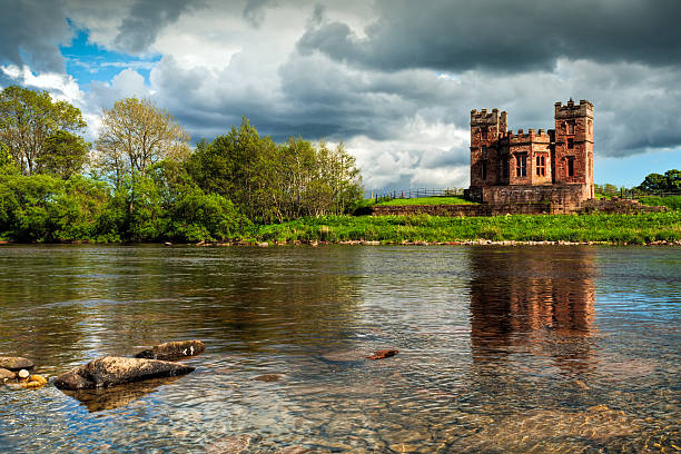 Virtually on the Scottish Border, this crenellated salmon coop is situated on the banks of the River Esk. Although coops are normally associated with the keeping of poultry, the term is also used to refer to a device for trapping salmon. The folly is a striking example of a Gothic pavillion and was built around 1772 for the Reverend Robert Graham who was the owner of the nearby Netherby Hall. It overlooks the site of a stone weir which was used for fishing. After the weir failed, the house became derelict, briefly being converted to a home in the 1930's by a shepherd.