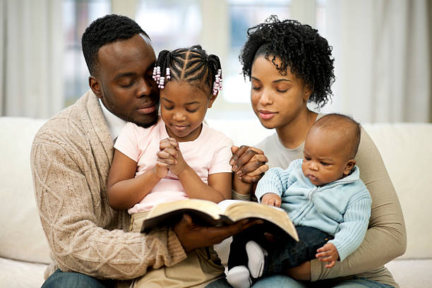 istock black family praying 174833297