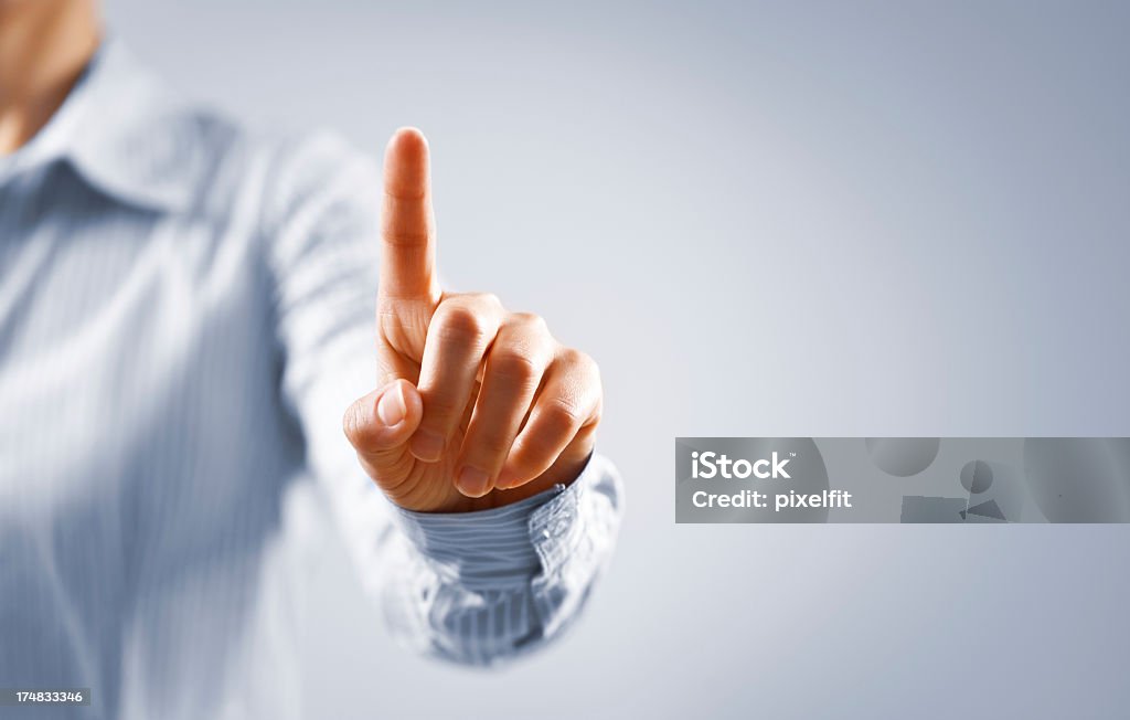 Businesswoman touch concept Woman's hand on focus Touch Screen Stock Photo