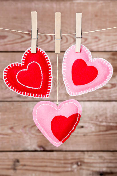 istock Clothesline with Valentine's Day hearts decorations on a rustic background 174833395