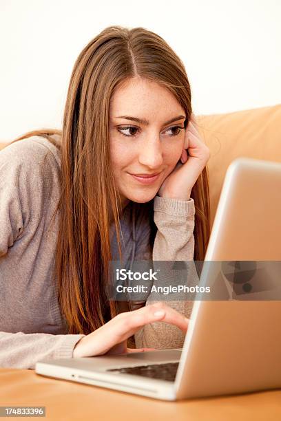 Young Woman With Laptop On Sofa Stock Photo - Download Image Now - Adult, Adults Only, Beautiful People