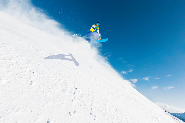 istock Freestyle snowboarder in a jump 174834083