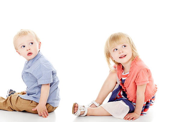 istock Happy little kids sitting on floor looking at copyspace 174834105