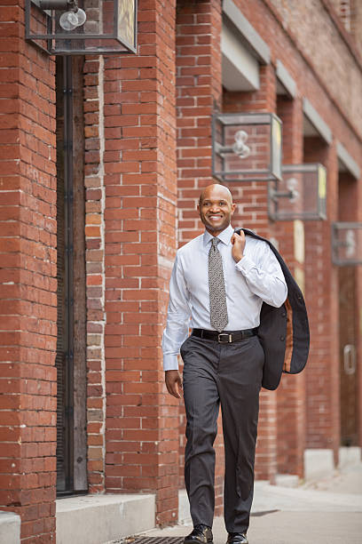 istock Businessman Holding Coat Over Shoulder 174834117