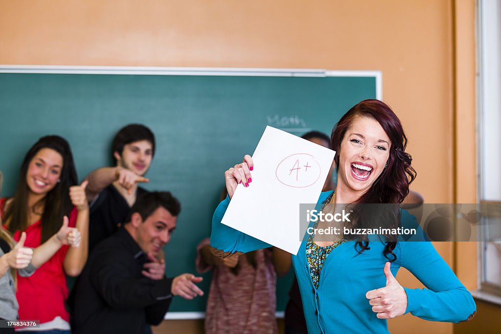 Showing her best score Very happy student with friend 16-17 Years Stock Photo