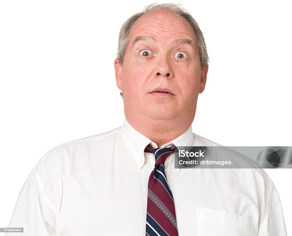 Nervous Mature Man Office Worker Raises Eyebrows Portrait of a mature adult man on a white background. Males Stock Photo