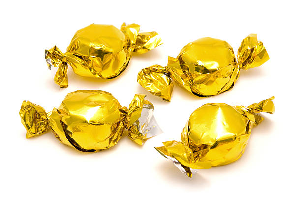 istock Sweets in gold foil wrappers 174834594