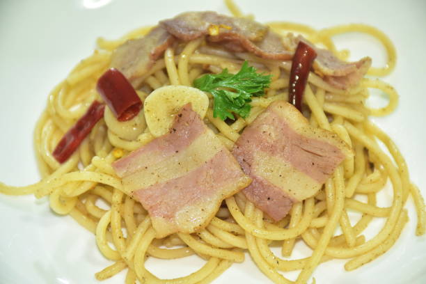 istock fried spaghetti topping crispy bacon and slice dry chili 1748350623