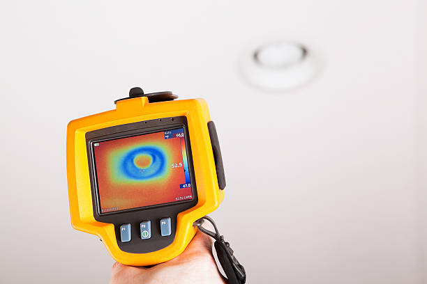 istock Infrared Thermal Imaging Camera Pointing to Ceiling Can Light 174835115