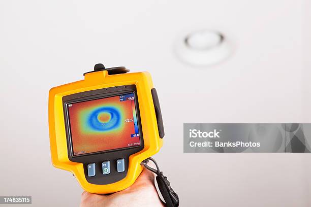 Infrared Thermal Imaging Camera Pointing To Ceiling Can Light Stock Photo - Download Image Now