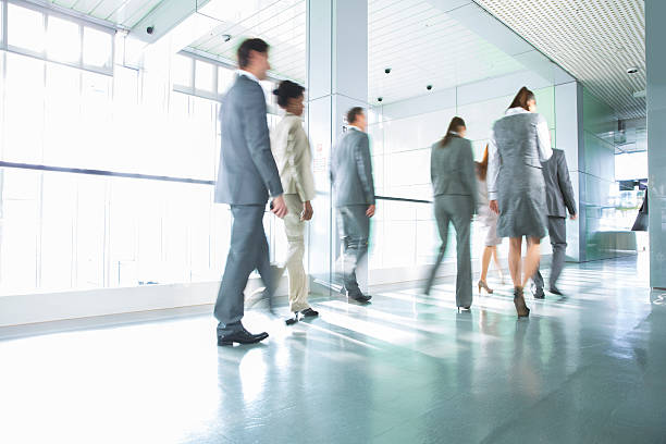 istock Group of business people walking on corridor 174835558