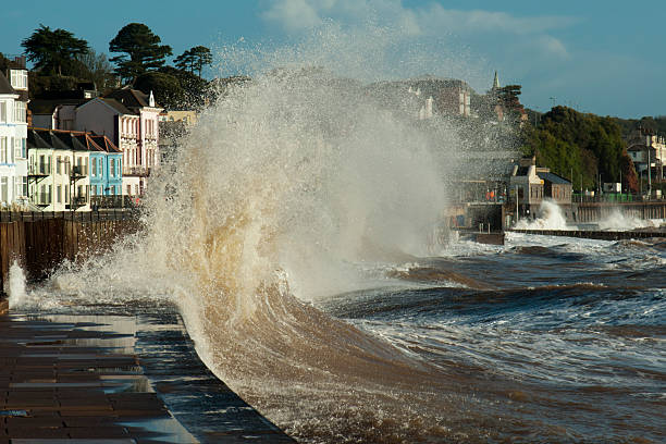 istock Wave breaking over sea wall onto railway track at Dawlish 174835689