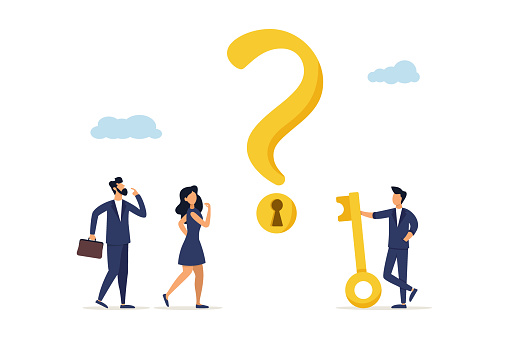 Businessman holding a golden key to open the keyhole on a question mark and help the team in resolving the issue. The key to answering the problem and questions is understanding the concept.