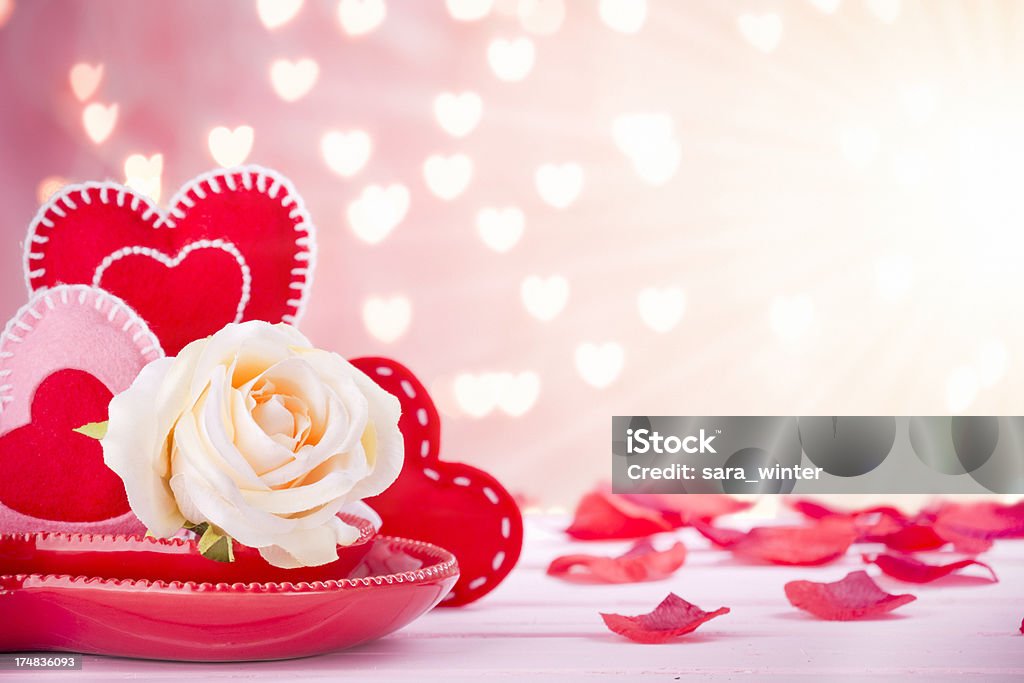 Valentine's decorations on a bright pink background A Valentine still life in bright sunlight. Backgrounds Stock Photo