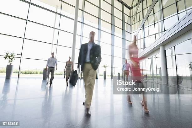 Business People Walking In Office Stock Photo - Download Image Now - 20-29 Years, 30-39 Years, 50-59 Years