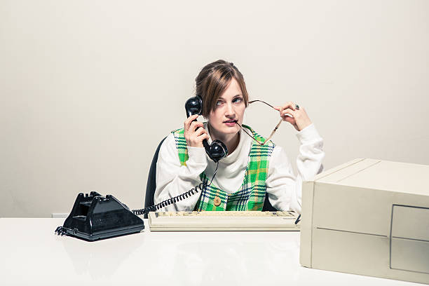 istock Secretary Frustrated at Work While on the Phone 174836405