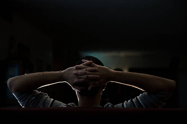 istock Man watching tv relaxed on the sofa 174836927
