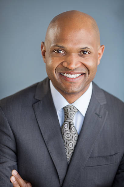 istock Mid Adult Businessman Smiling 174838164
