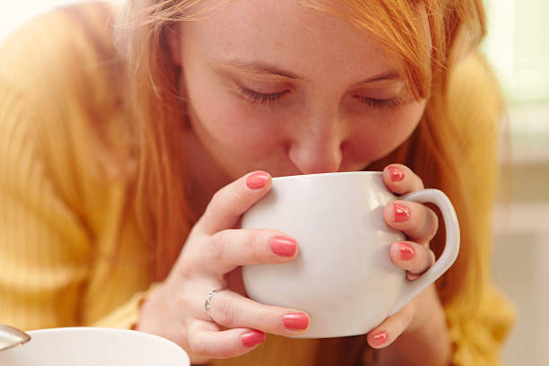 istock Girl drinking a hot drink. 174838279